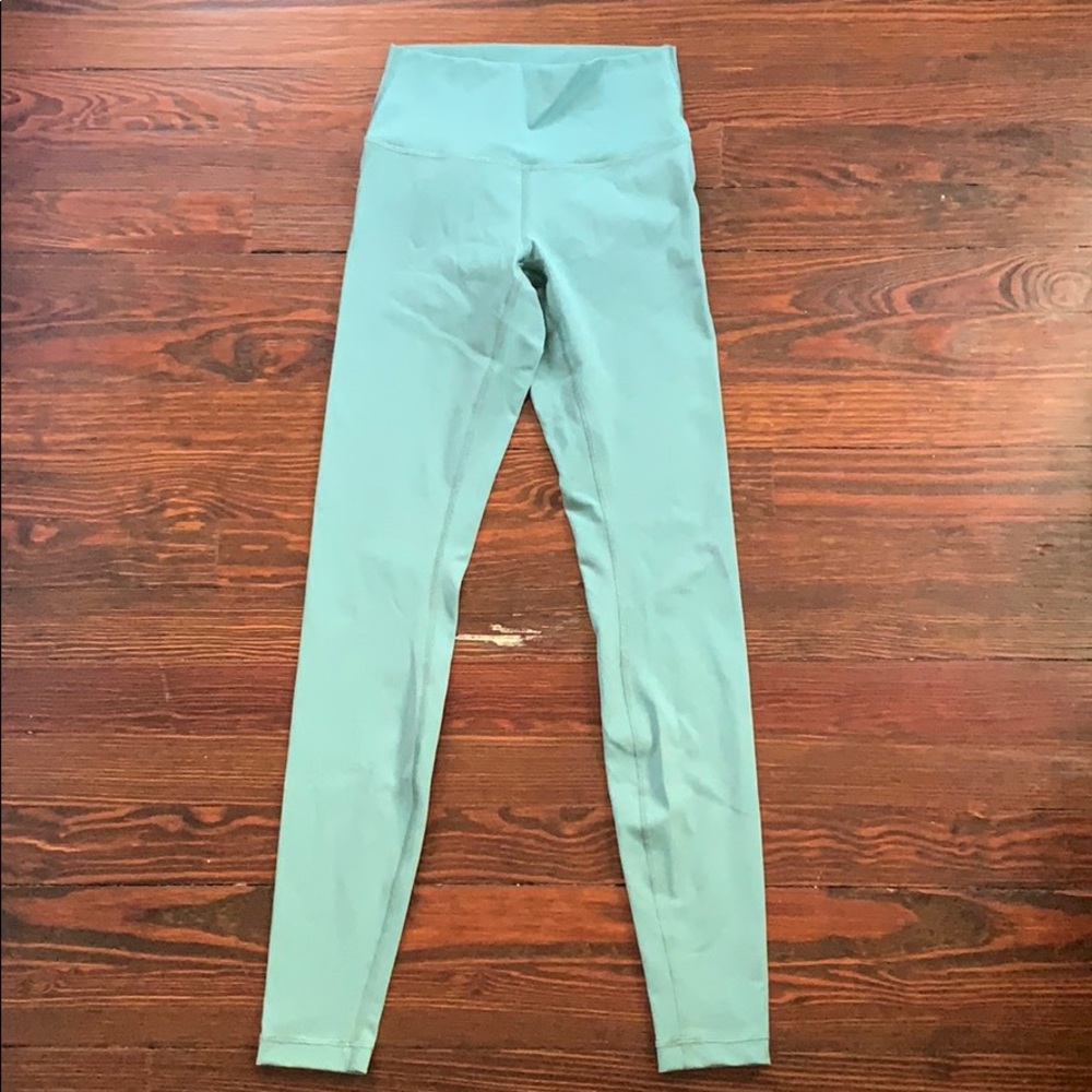 Size 6 Lululemon women’s teal leggings